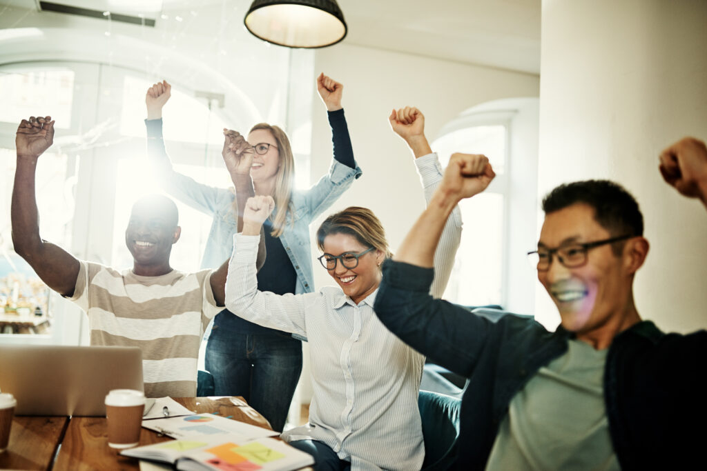 A team celebrating their good work performance.